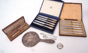 Mixed Lot: two cased sets of six each silver handled tea knives, together with cased christening