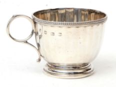 George VI christening mug of faceted form with beaded rim, ring side handle on spreading foot,