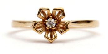 Modern 9ct gold diamond ring, pierced flowerhead design with a small central diamond point, size O