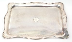 George V dressing table tray of shaped rectangular form with shaped rim and engine turned field with