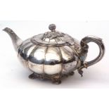 Mid-19th century silver on copper tea pot of compressed melon form with hinged cover, width 30cms