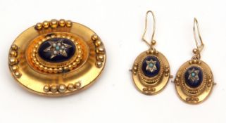 Antique gilt metal and enamel brooch, and matching earrings, each having a central oval blue