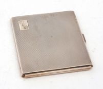 George VI cigarette case of hinged and sprung rectangular form with all over engine turned