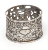 Late 19th century Chinese white metal napkin ring of cylindrical form, pierced and chased form and