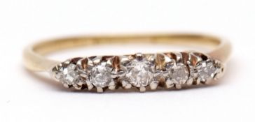 Precious metal five-stone ring, claw set with 5 graduated small single cut diamonds, raised in a