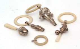 Mixed Lot: three various hallmarked silver combination rattles/teethers, together with a further