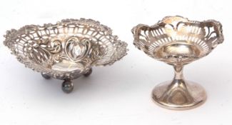 Mixed Lot: two various bon-bon baskets, both with pierced and embossed foliate detail, one raised on