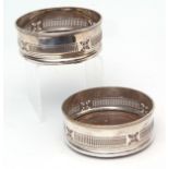 Pair of late 19th century silver on copper bottle coasters, each of typical circular form with
