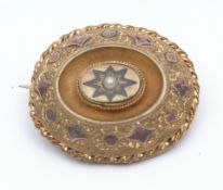 Victorian gilt metal and gold mourning brooch, oval shaped with a centre pearl in a black