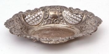 Late Victorian oval table basket of shaped form and C-scroll and floral embossed detail, with