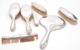 George V part dressing table set comprising hand mirror, two hair brushes, two clothes brushes,