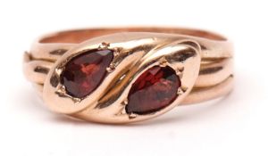 9ct gold and garnet serpent ring, the plain polished design of two entwined serpents, each having an