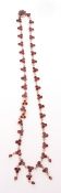 Vintage Bohemian garnet and gilt metal necklace, each link a cluster of three deep red small
