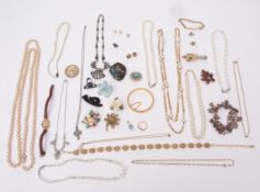 Four small boxes of costume jewellery including a white leatherette box containing bead necklace,