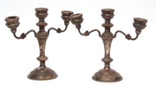 Two Elizabeth II three-light candelabra, with fixed sconces on scrolling arms to a central light