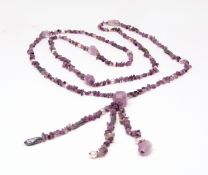 Modern glass amethyst coloured bead necklace, a long row of faceted beads, small amethyst