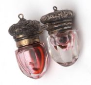 Two silver mounted and clear cut glass vinaigrettes, each with hinged and domed foliate embossed