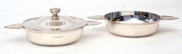 Two 20th century serving dishes, each of polished circular form and with foliate shaped side handles