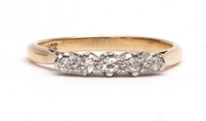 Precious metal five stone diamond ring, having five small graduated diamonds set in a pierced raised