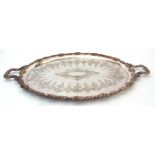 Late 19th century electro-plated oval two-handled tea tray, with fruiting vine applied border and