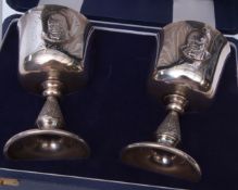 Cased pair of Elizabeth II commemorative goblets "Churchill Centenary 1874-1974" and each of bell