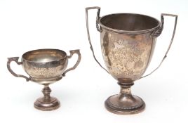 Mixed Lot: two various presentation engraved trophy cups, each of goblet form with twin handles on