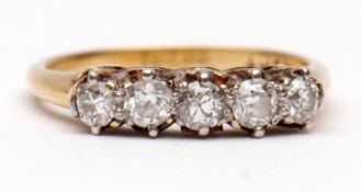 Five-stone diamond ring, row of five small brilliant cut diamonds, claw set in a pierced gallery