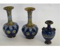 Pair of blue ground Doulton baluster vases, decorated by Emily Partington, with factory mark and