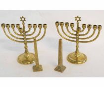 Pair of nine-branch Menorah candlesticks, together with two smaller etched brass obelisks, tallest