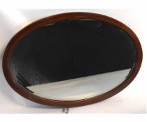 Edwardian mahogany oval and inlaid wall mirror with bevelled glass, 75cms wide x 51cms high