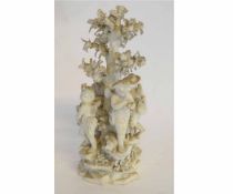 19th century Derby biscuit group of cherubs around a tree (damages), 22cms high