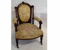 Victorian walnut carved armchair with ring turned columns and carved back rail, with floral