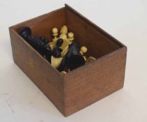 Full set of white and black stained ivory chess pieces with some damage