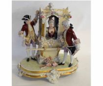 Modern Royal Dux centrepiece decorated as an lady in 18th century dress in a sedan chair accompanied