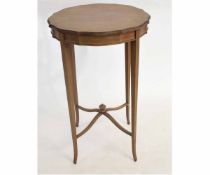 Edwardian mahogany circular top occasional table on tapering square legs supported by an X