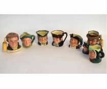 Collection of eight small Royal Doulton character jugs including a Jim Beam whiskey flask, and a