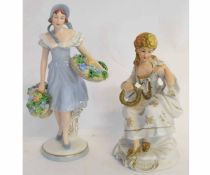 Royal Dux model of a flower girl on a round base, together with a further bisque porcelain figure of