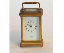 Brass framed carriage clock with white enamel Arabic chapter ring