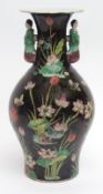 Chinese porcelain vase decorated in famille rose enamels with lotus and aquatic scenes against a