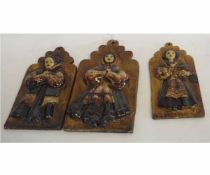 Group: three pottery plaques of young girls in predominantly brown glazes, all signed Le Trichent