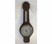 Mid-20th century oak framed wheel barometer by Barrett of Ipswich, with a silvered dial, 64cms drop