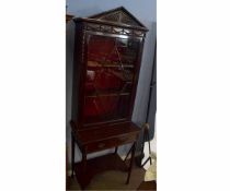 Early 20th century mahogany display cabinet on stand with single astragal glazed door with