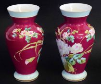 Pair of baluster porcelain vases, late 19th/early 20th century, puce ground decorated with floral