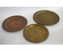 Brass and coppered etched Indian tray together with a further pressed and etched copper example