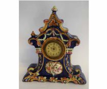 French porcelain decorative mantel clock, decorated in underglaze blue with painted and raised