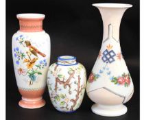 Group of three milk glass vases, variously painted with flowers and branches, and a separate vase