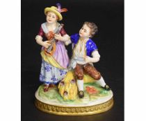 Porcelain group of two children, one playing the violin on a gilt oval base, impressed numerals to