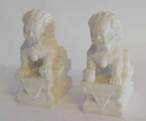 Pair of Oriental carved stone dragons on rectangular bases, 19cms high