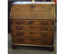 18th century oak formed drop fronted bureau with fitted interior, with drop front over four full