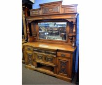 19th century oak mirrored back sideboard with decorative carved panels and turned and fluted